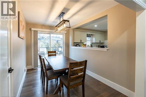 Dining area with dark wood finished floors and baseboards - 266 Melrose Avenue, Kitchener, ON - Indoor Photo Showing Dining Room