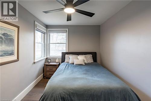 Bedroom with dark wood finished floors and a ceiling fan - 266 Melrose Avenue, Kitchener, ON - Indoor Photo Showing Bedroom