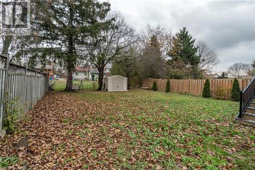 Fenced backyard with a storage shed - 266 Melrose Avenue, Kitchener, ON - Outdoor With Backyard