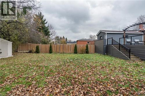 View of yard featuring stairs, a deck, and a storage shed - 266 Melrose Avenue, Kitchener, ON - Outdoor