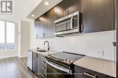 2202 - 3220 William Coltson Avenue, Oakville, ON - Indoor Photo Showing Kitchen With Upgraded Kitchen