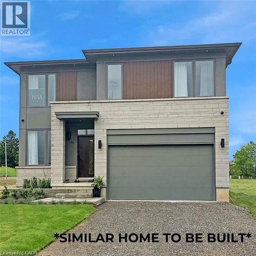 Contemporary home with a garage, a front yard, and driveway - 435 Klein Circle, Ancaster, ON - Outdoor