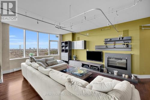 1406 - 3580 Rivergate Way, Ottawa, ON - Indoor Photo Showing Living Room With Fireplace