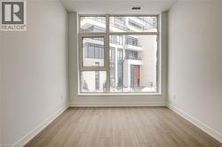 Spare room with light wood-style floors and healthy amount of natural light - 