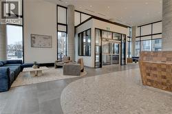 Lobby featuring a towering ceiling and expansive windows - 