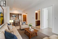 Living area featuring wood finished floors and baseboards - 