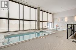 View of swimming pool featuring a sunroom - 