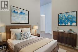 Bedroom featuring light wood-style floors and a towering ceiling - 