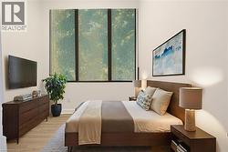 Bedroom with light wood-style floors - 