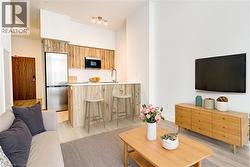 Living room with light wood-type flooring - 