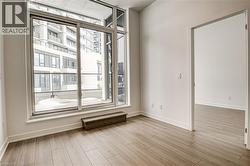 Spare room with light wood-style flooring and baseboards - 