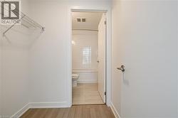 Full bath with light wood-style floors and shower / washtub combination - 