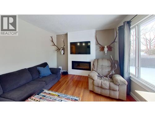 8824 Pine Road, Fort St. John, BC - Indoor Photo Showing Living Room With Fireplace