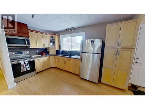 8824 Pine Road, Fort St. John, BC - Indoor Photo Showing Kitchen With Double Sink