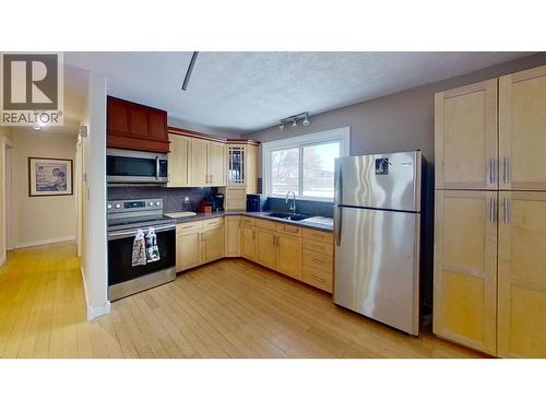 8824 Pine Road, Fort St. John, BC - Indoor Photo Showing Kitchen With Double Sink