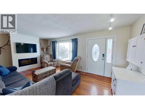 8824 Pine Road, Fort St. John, BC - Indoor Photo Showing Living Room With Fireplace