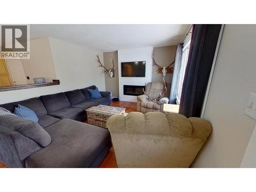 8824 Pine Road, Fort St. John, BC - Indoor Photo Showing Living Room With Fireplace