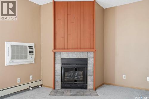 303 205 Kingsmere Boulevard, Saskatoon, SK - Indoor Photo Showing Living Room With Fireplace