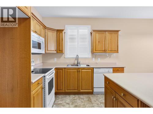 NO FRIDGE - otherwise white appliances - 3360 Old Okanagan Highway Unit# 160, West Kelowna, BC - Indoor Photo Showing Kitchen With Double Sink