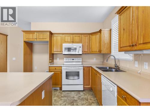 NO FRIDGE - otherwise white appliances - 3360 Old Okanagan Highway Unit# 160, West Kelowna, BC - Indoor Photo Showing Kitchen With Double Sink