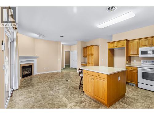 3360 Old Okanagan Highway Unit# 160, West Kelowna, BC - Indoor Photo Showing Kitchen With Fireplace