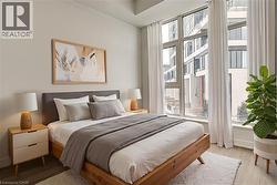 Bedroom with wood finished floors and baseboards - 