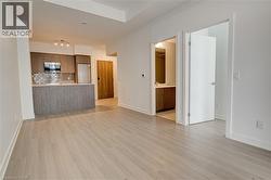 Unfurnished living room with light wood finished floors and baseboards - 