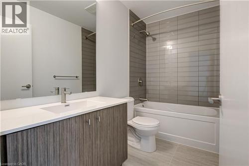 Full bathroom with vanity, tub / shower combination, and light tile patterned flooring - 25 Wellington Street A S Unit# 209, Kitchener, ON - Indoor Photo Showing Bathroom
