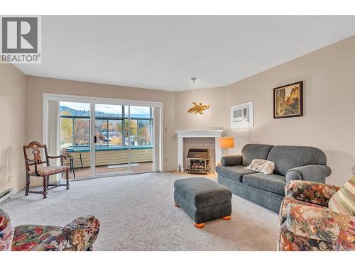 965 King Street Unit# 308, Penticton, BC - Indoor Photo Showing Living Room With Fireplace
