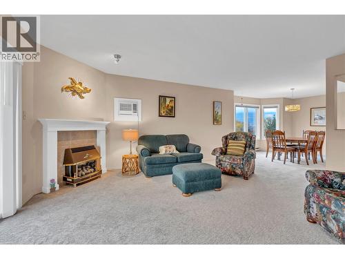 965 King Street Unit# 308, Penticton, BC - Indoor Photo Showing Living Room With Fireplace