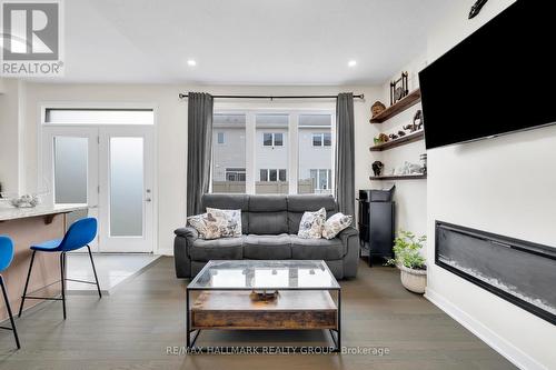 1076 Curraglass Walk, Ottawa, ON - Indoor Photo Showing Living Room With Fireplace