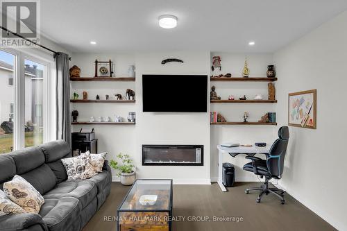 1076 Curraglass Walk, Ottawa, ON - Indoor Photo Showing Living Room With Fireplace