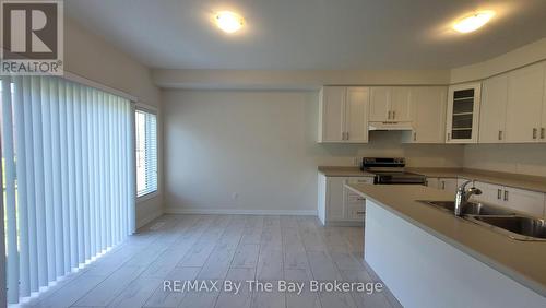 65 Federica Crescent, Wasaga Beach, ON - Indoor Photo Showing Kitchen With Double Sink