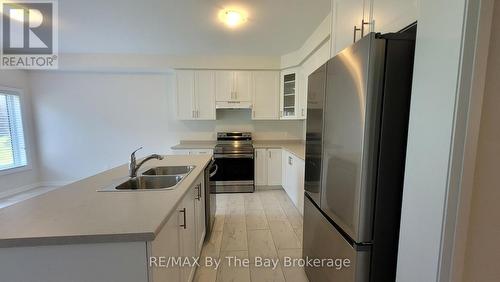 65 Federica Crescent, Wasaga Beach, ON - Indoor Photo Showing Kitchen With Double Sink