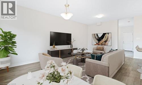 Living area featuring wood finished floors and baseboards - 103 Mclaughlin Street, Welland, ON - Indoor