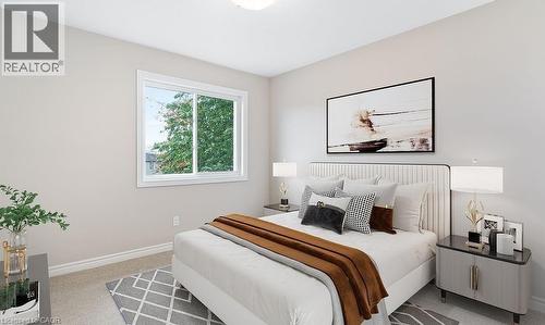 Bedroom featuring baseboards and light carpet - 103 Mclaughlin Street, Welland, ON - Indoor Photo Showing Bedroom