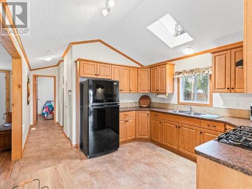 8 Tagish River Road, Whitehorse South, YT - Indoor Photo Showing Kitchen With Double Sink