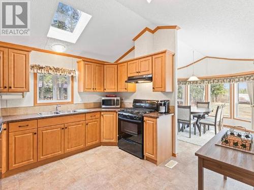 8 Tagish River Road, Whitehorse South, YT - Indoor Photo Showing Kitchen With Double Sink