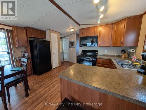 2 White Pines Trail, Wasaga Beach, ON - Indoor Photo Showing Kitchen With Double Sink