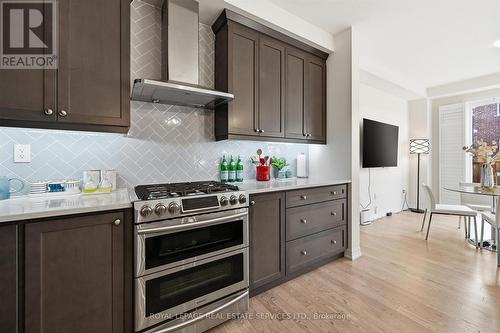 The Gourmet Kitchen Showcases Quartz Countertops - 3300 Jacob Way, Oakville, ON - Indoor Photo Showing Kitchen With Upgraded Kitchen