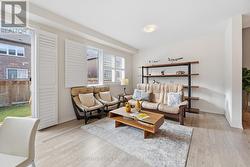 Spacious Living Room with a Walkout to Backyard - 