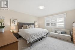Generous Primary Bedroom Offers a Walk-In Closet - 