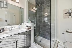 Primary Ensuite Offers a Frameless Glass Shower - 