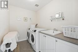 Convenient Upper Level Laundry Room - 