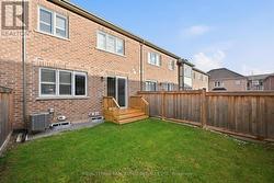 Living Room Walkout to Fully Fenced Backyard - 