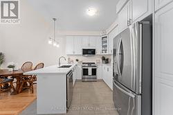 Quartz counters in kitchen, ceramic floor - 