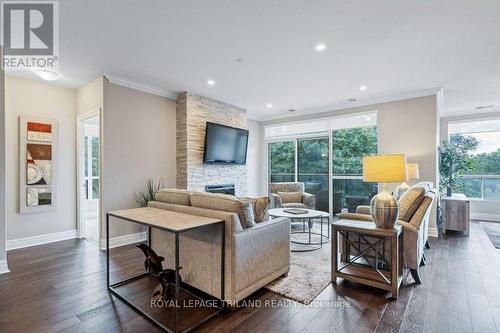 504 - 1200 Commissioners Road W, London South (South B), ON - Indoor Photo Showing Living Room With Fireplace
