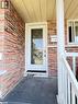 View of exterior entry with brick siding and covered porch - 86 Overlea Crescent Unit# Main, Waterloo, ON  - Outdoor With Exterior 