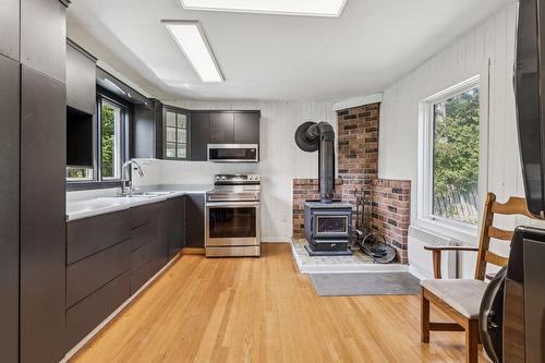 Cuisine - 153 Rue Marleau, Denholm, QC - Indoor Photo Showing Kitchen With Fireplace