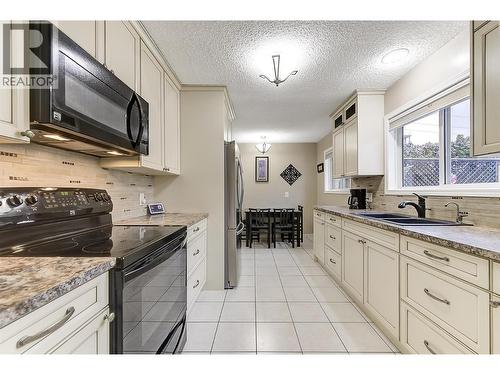 2030 Wilkinson Street, Kelowna, BC - Indoor Photo Showing Kitchen With Double Sink